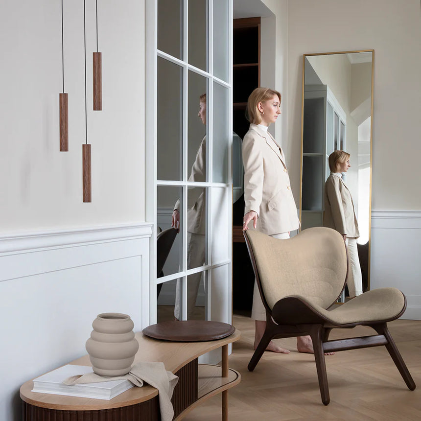 The Conversation Piece fabric armchair with natural frame