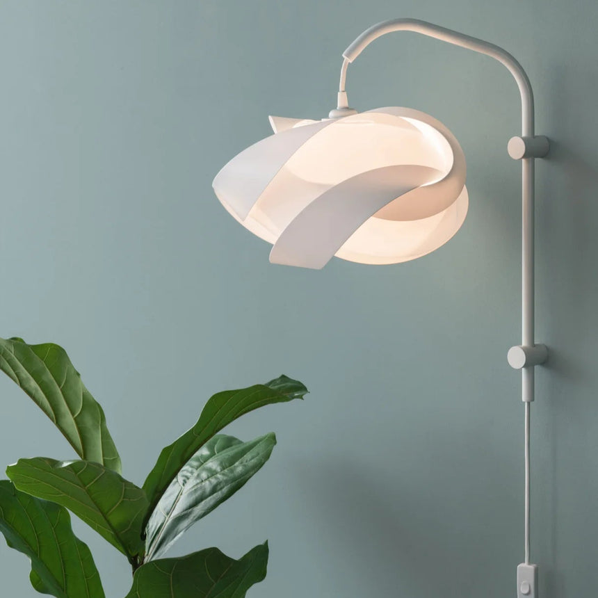 The Conversation Piece fabric armchair with natural frame