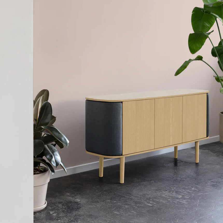 The Conversation Piece fabric armchair with natural frame