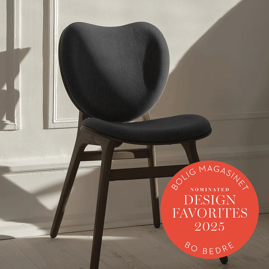 The Conversation Piece fabric armchair with natural frame