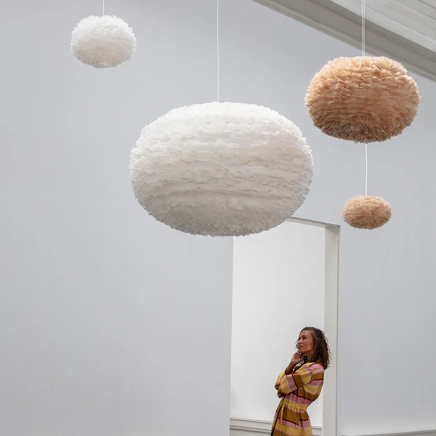 The Conversation Piece fabric armchair with natural frame