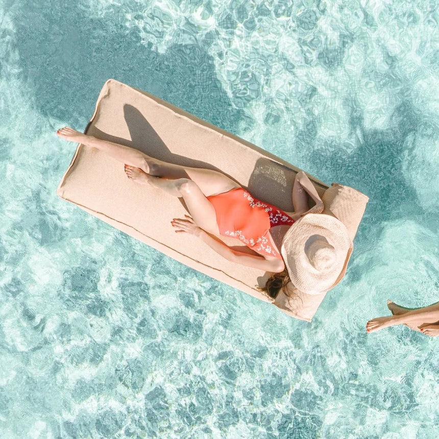 Raffia-effect floating fabric sun lounger with headrest