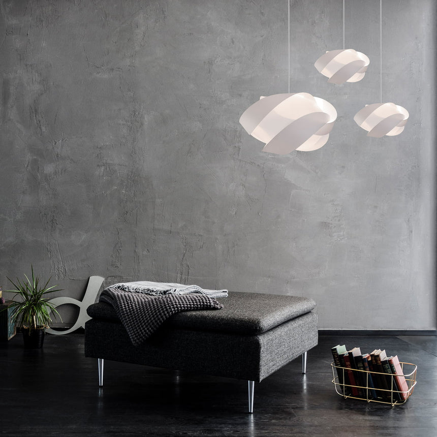 The Conversation Piece fabric armchair with natural frame