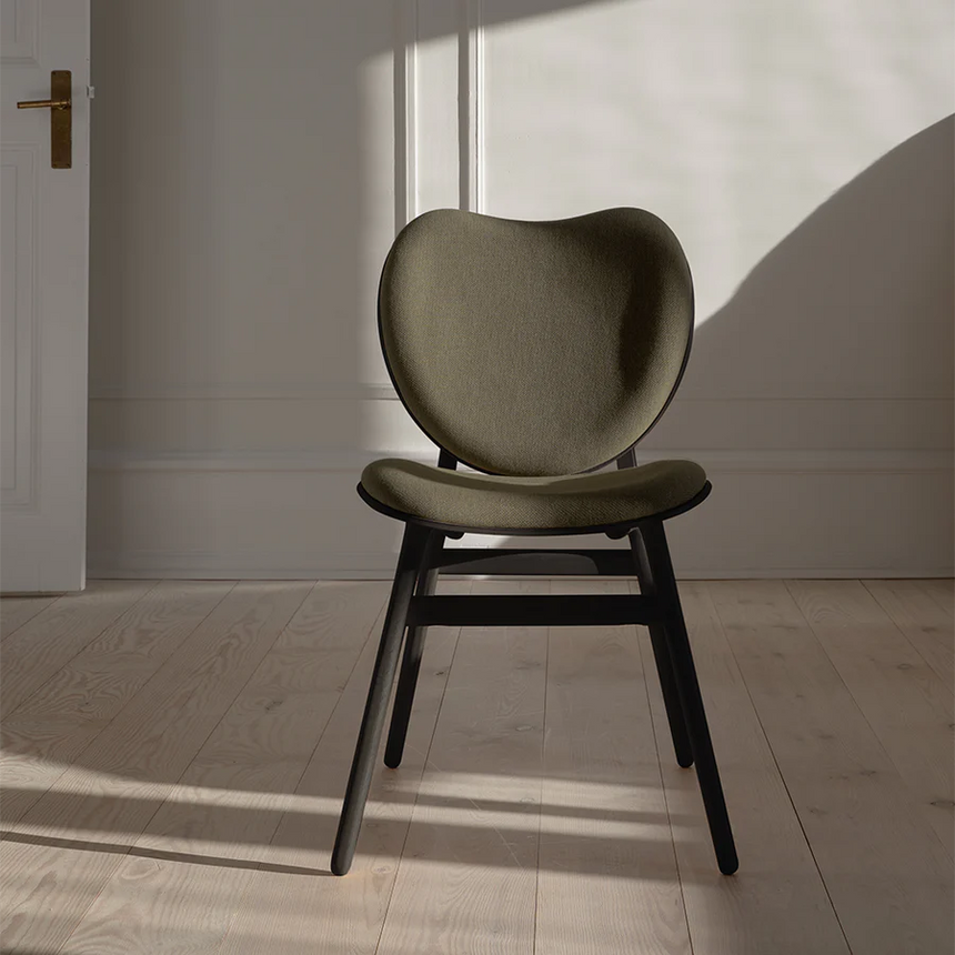 The Conversation Piece fabric armchair with natural frame