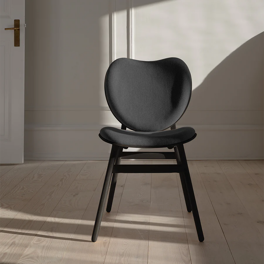 The Conversation Piece fabric armchair with natural frame