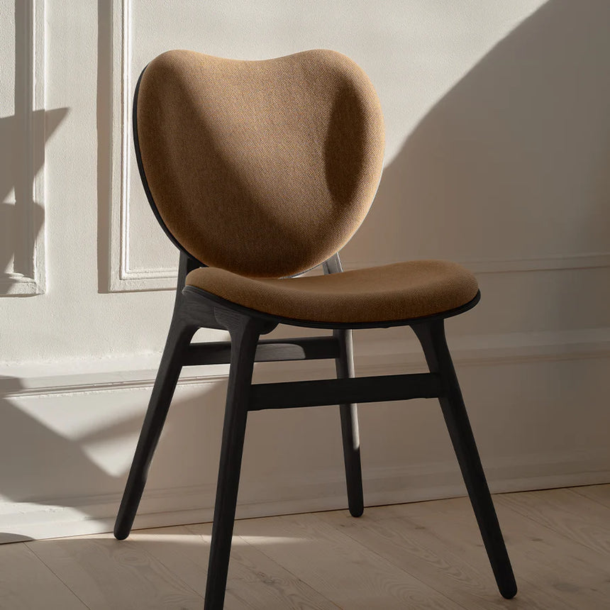 The Conversation Piece fabric armchair with natural frame