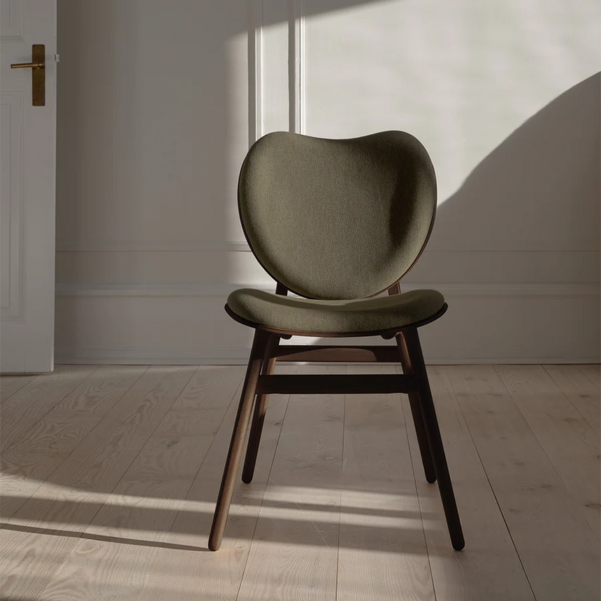 The Conversation Piece fabric armchair with natural frame