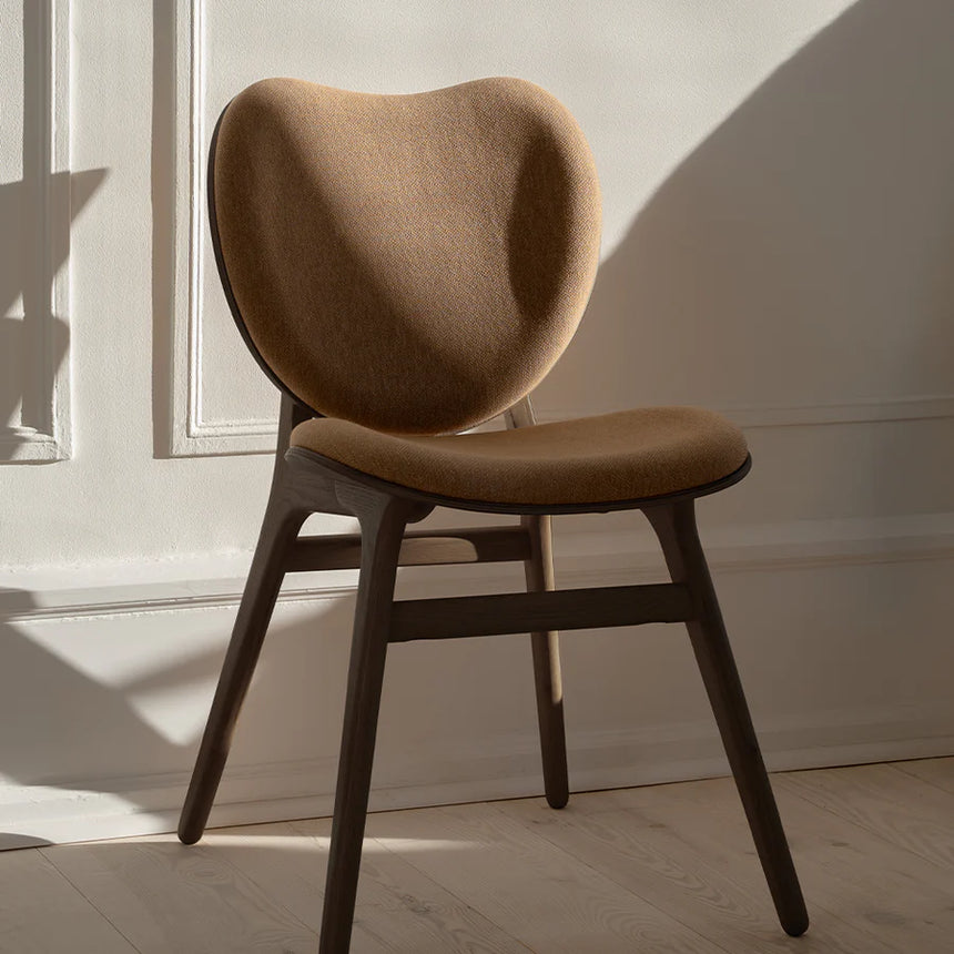 The Conversation Piece fabric armchair with natural frame