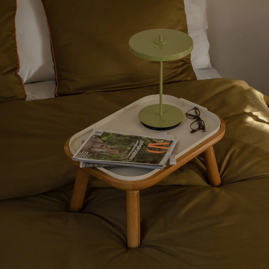 The Conversation Piece fabric armchair with natural frame