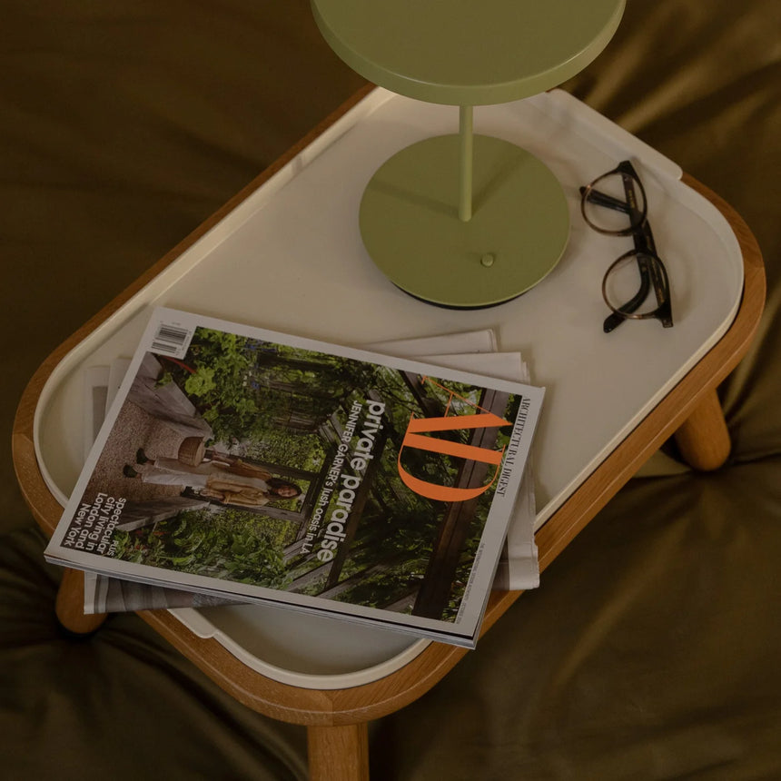 The Conversation Piece fabric armchair with natural frame