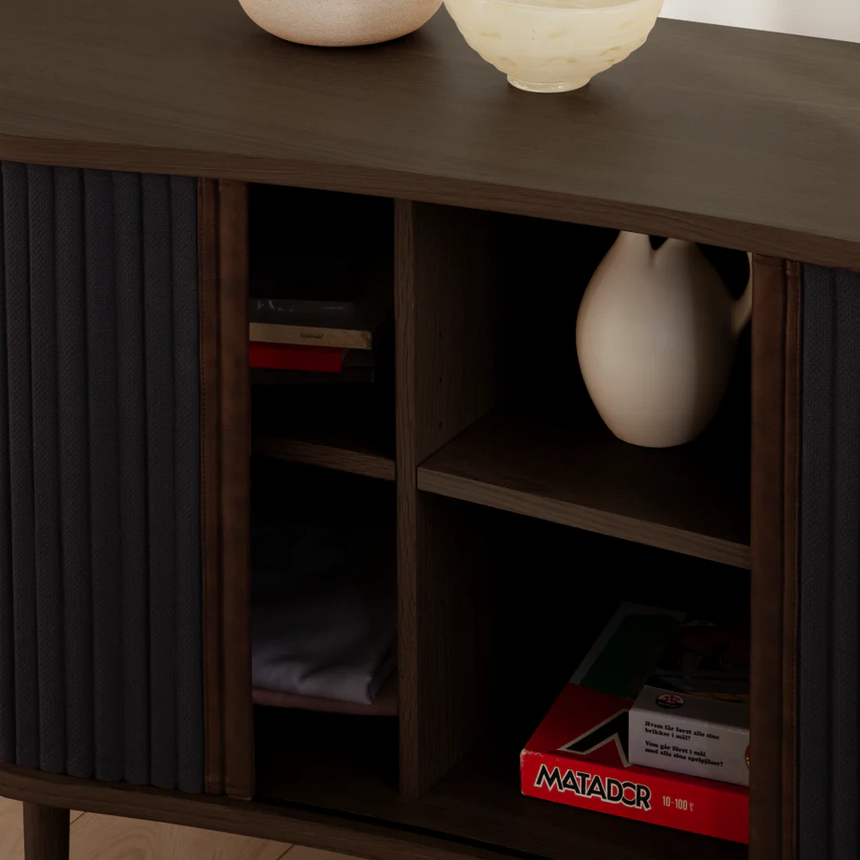 The Conversation Piece fabric armchair with natural frame