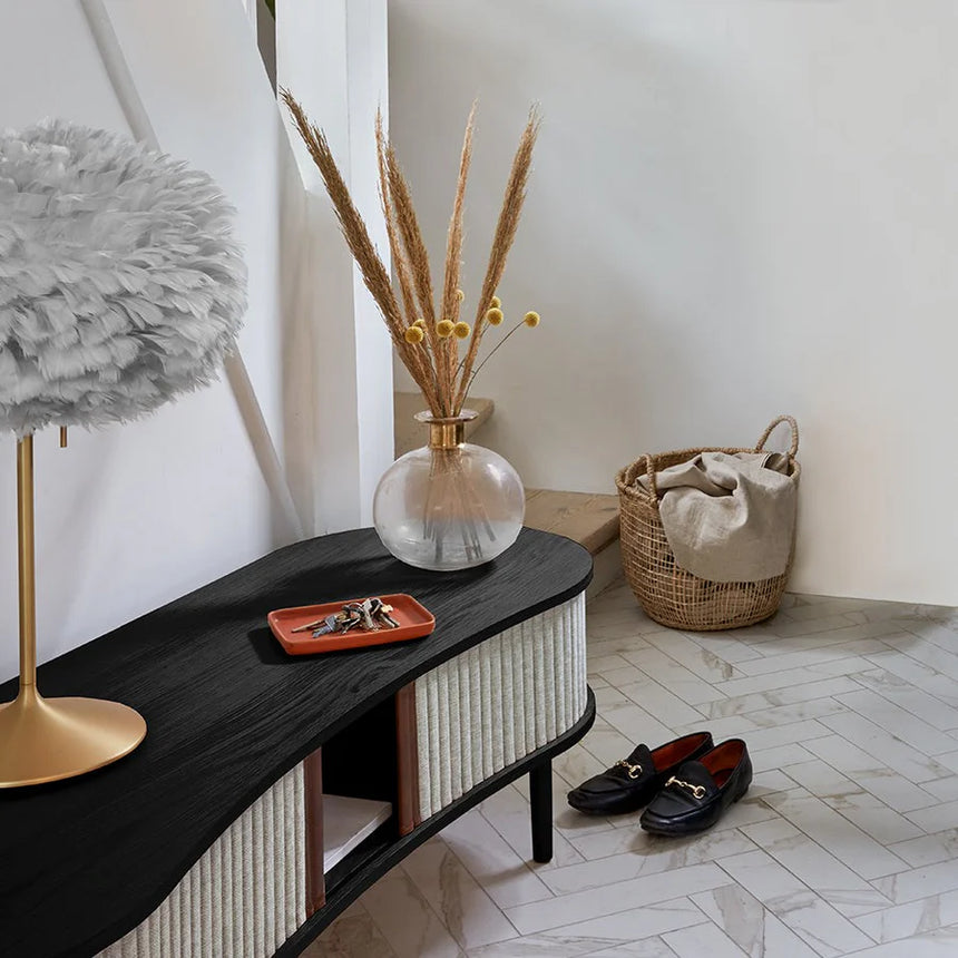 The Conversation Piece fabric armchair with natural frame