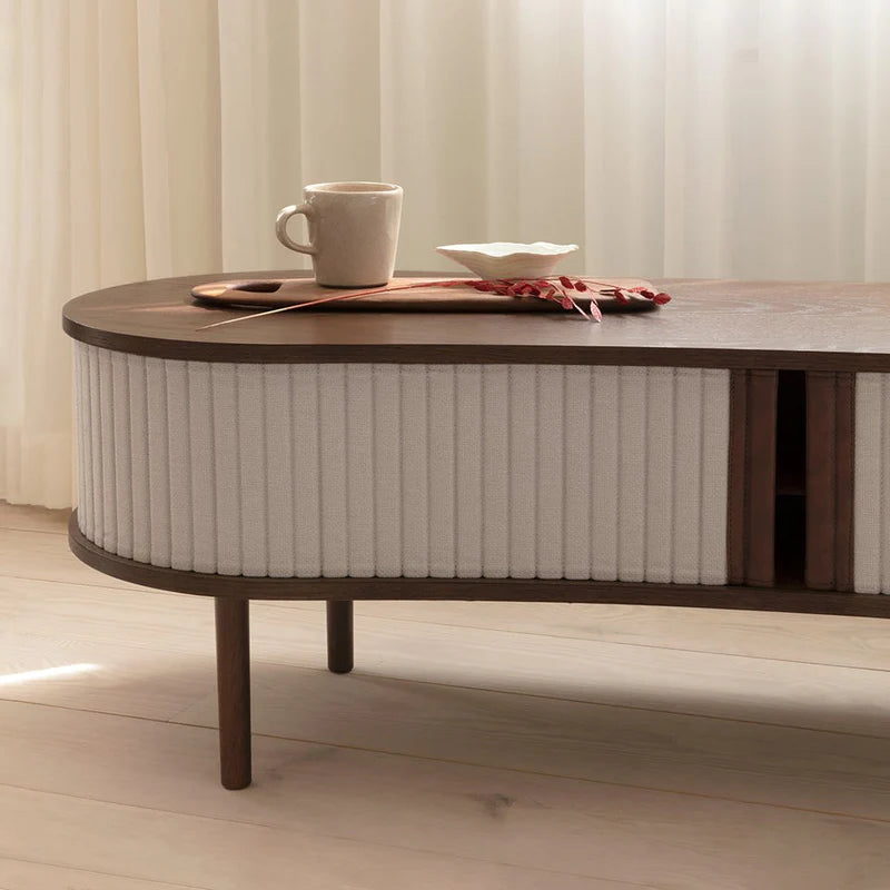 The Conversation Piece fabric armchair with natural frame