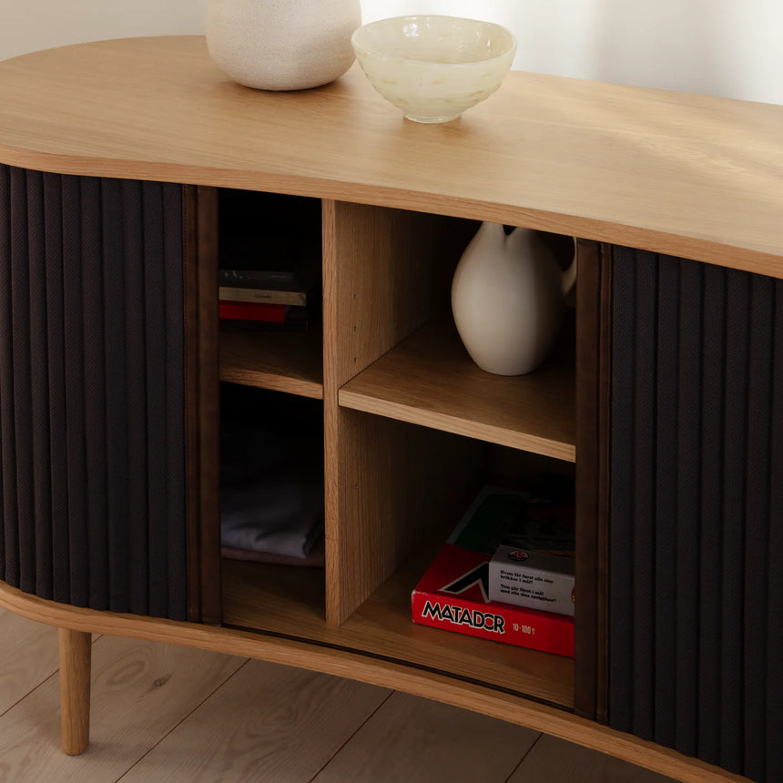 The Conversation Piece fabric armchair with natural frame