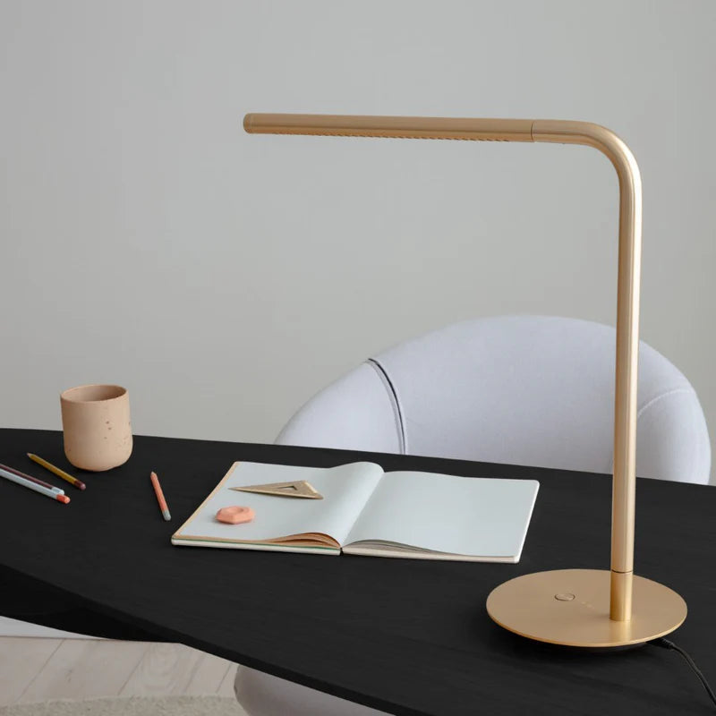 The Conversation Piece fabric armchair with natural frame