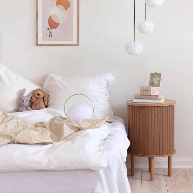 The Conversation Piece fabric armchair with natural frame