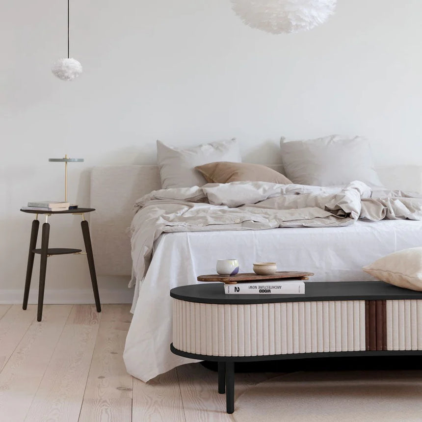 The Conversation Piece fabric armchair with natural frame