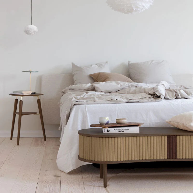 The Conversation Piece fabric armchair with natural frame