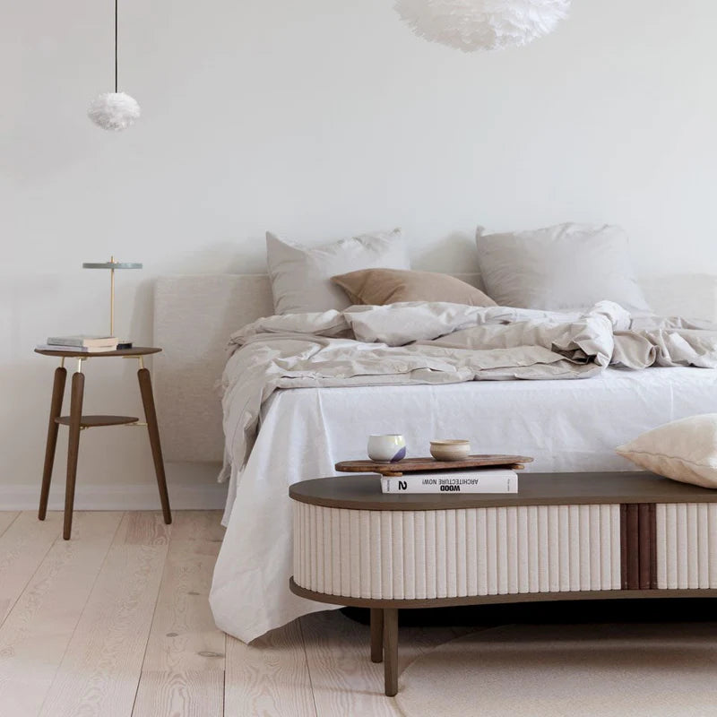 The Conversation Piece fabric armchair with natural frame