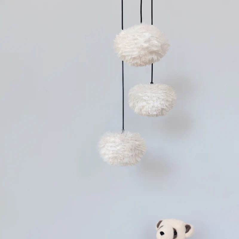 The Conversation Piece fabric armchair with natural frame