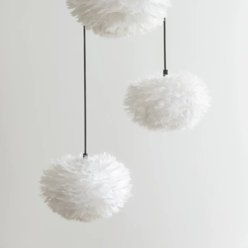 The Conversation Piece fabric armchair with natural frame