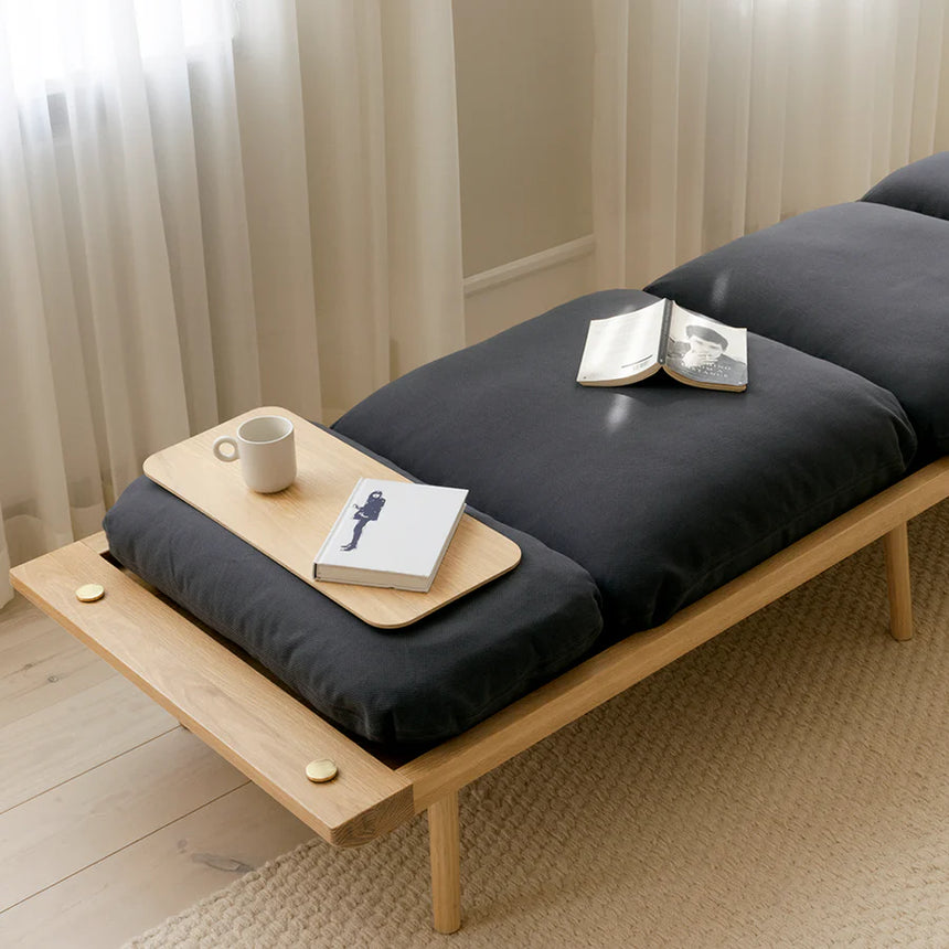 The Conversation Piece fabric armchair with natural frame