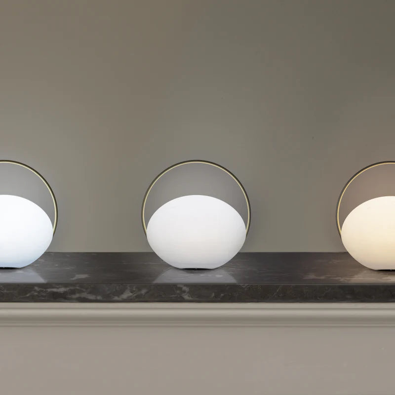 The Conversation Piece fabric armchair with natural frame