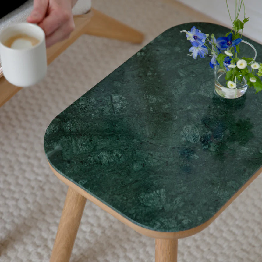 The Conversation Piece fabric armchair with natural frame