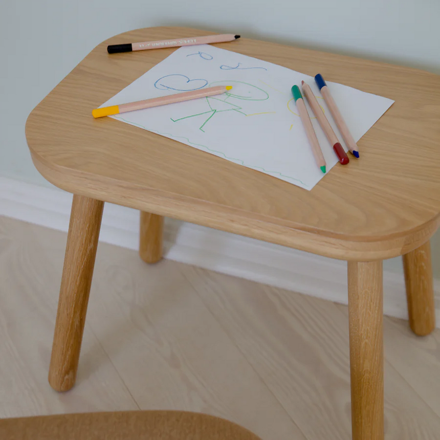 The Conversation Piece fabric armchair with natural frame