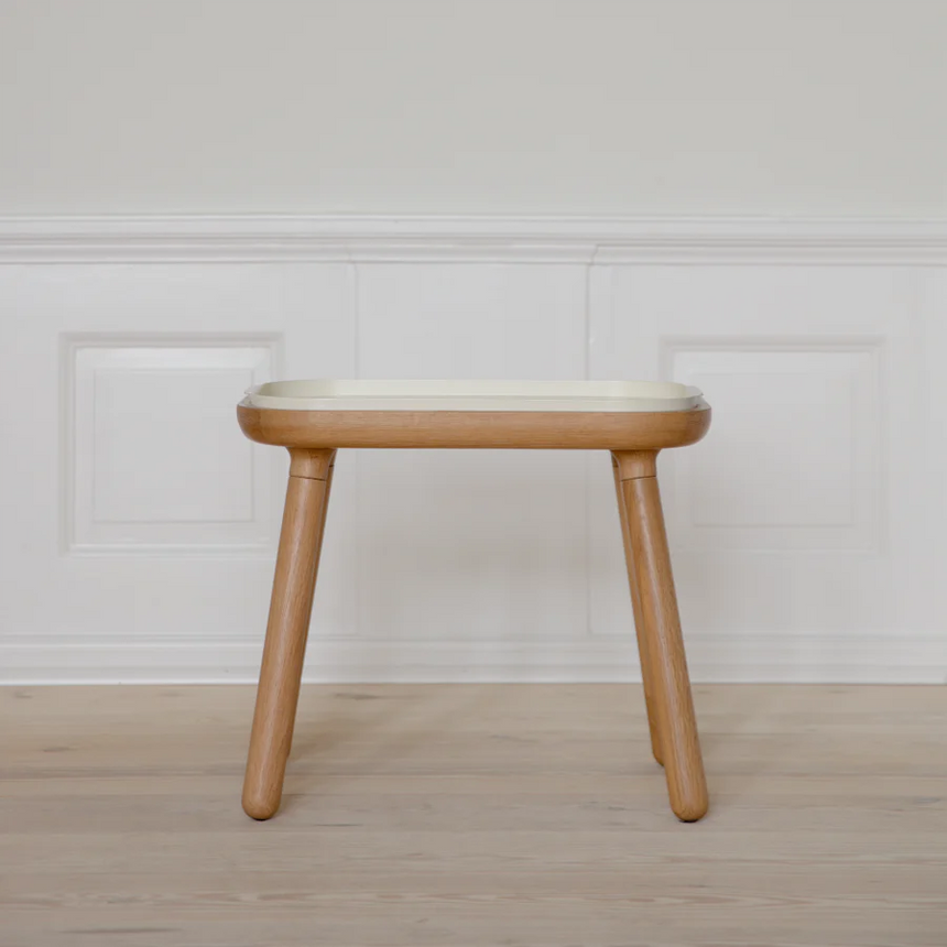 The Conversation Piece fabric armchair with natural frame