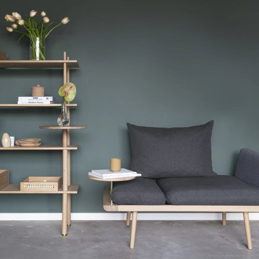 The Conversation Piece fabric armchair with natural frame