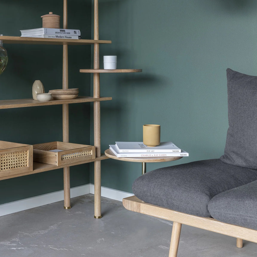 The Conversation Piece fabric armchair with natural frame