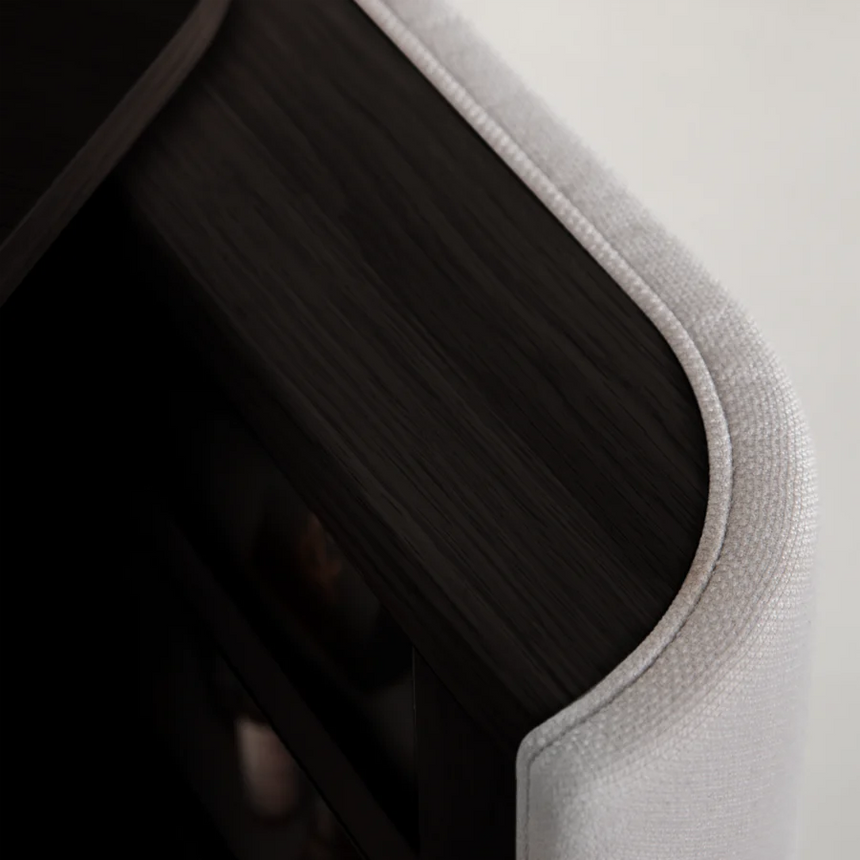 The Conversation Piece fabric armchair with natural frame