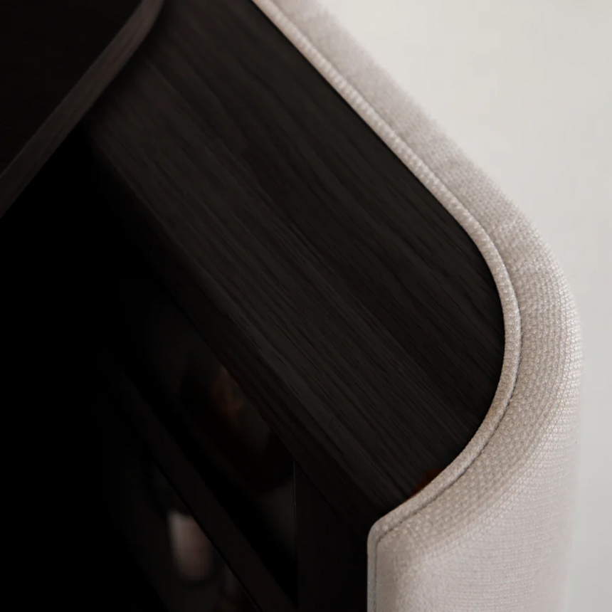 The Conversation Piece fabric armchair with natural frame