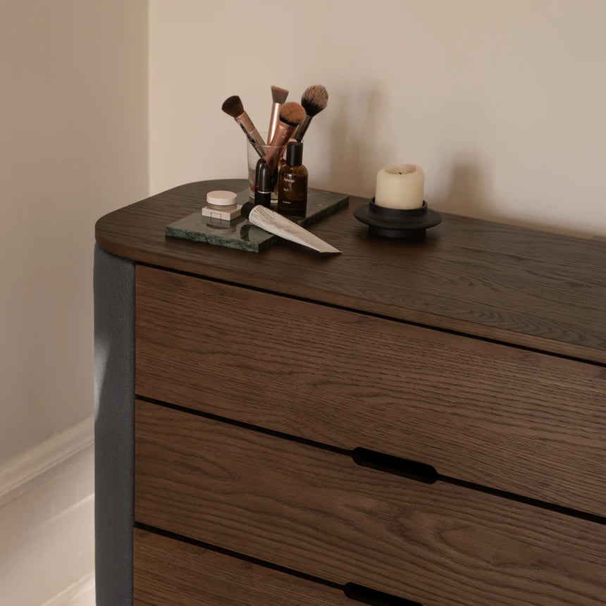 The Conversation Piece fabric armchair with natural frame