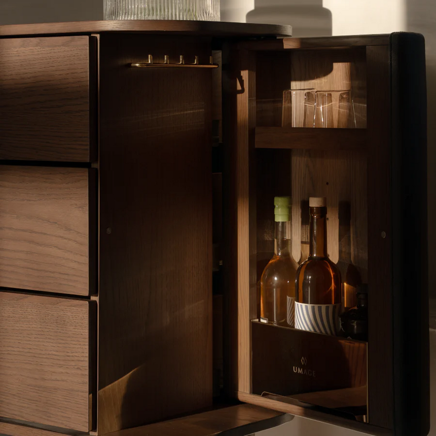 The Conversation Piece fabric armchair with natural frame