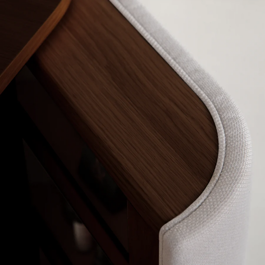 The Conversation Piece fabric armchair with natural frame