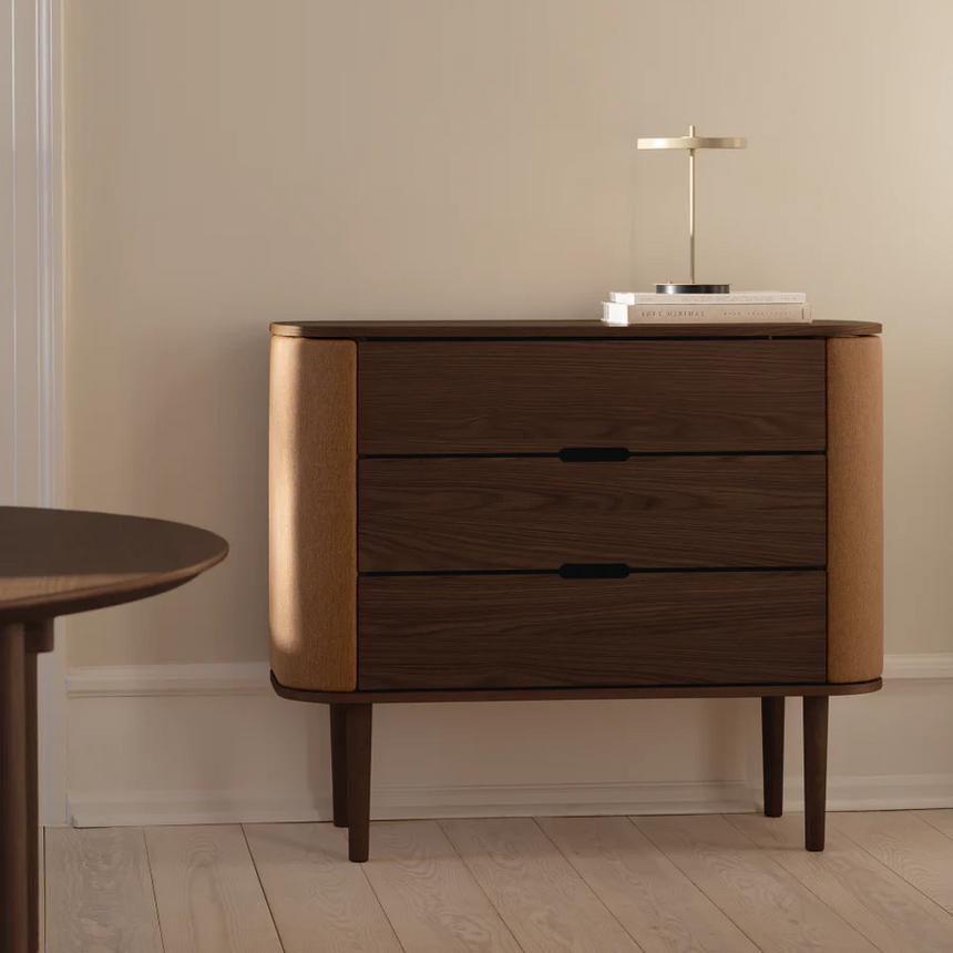 The Conversation Piece fabric armchair with natural frame