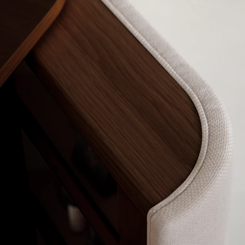 The Conversation Piece fabric armchair with natural frame