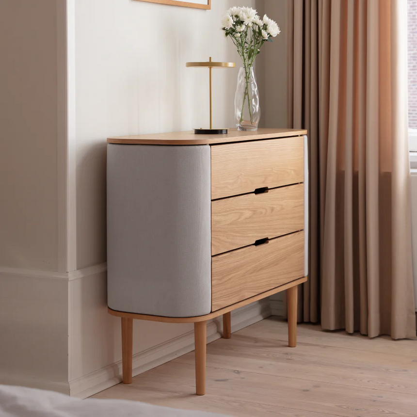 The Conversation Piece fabric armchair with natural frame