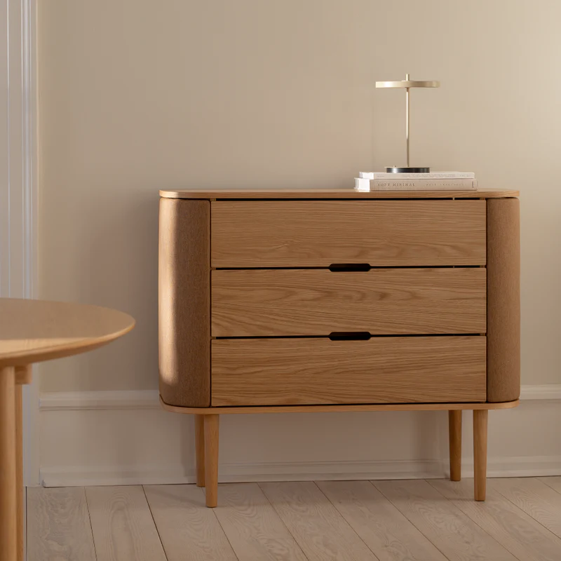 The Conversation Piece fabric armchair with natural frame