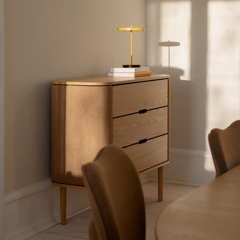 The Conversation Piece fabric armchair with natural frame