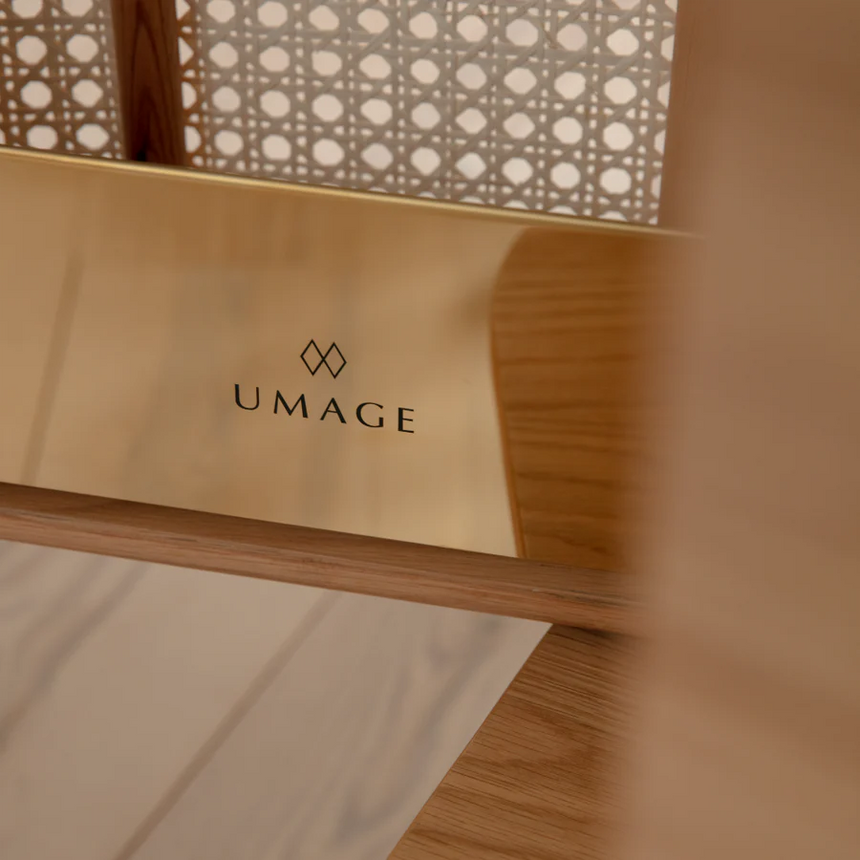 The Conversation Piece fabric armchair with natural frame