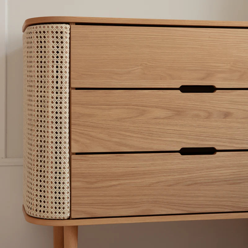 The Conversation Piece fabric armchair with natural frame