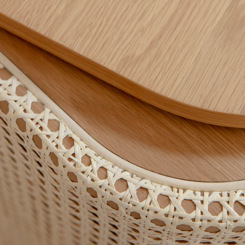 The Conversation Piece fabric armchair with natural frame