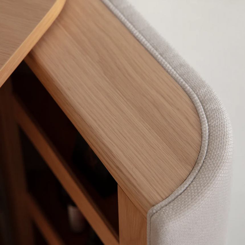 The Conversation Piece fabric armchair with natural frame