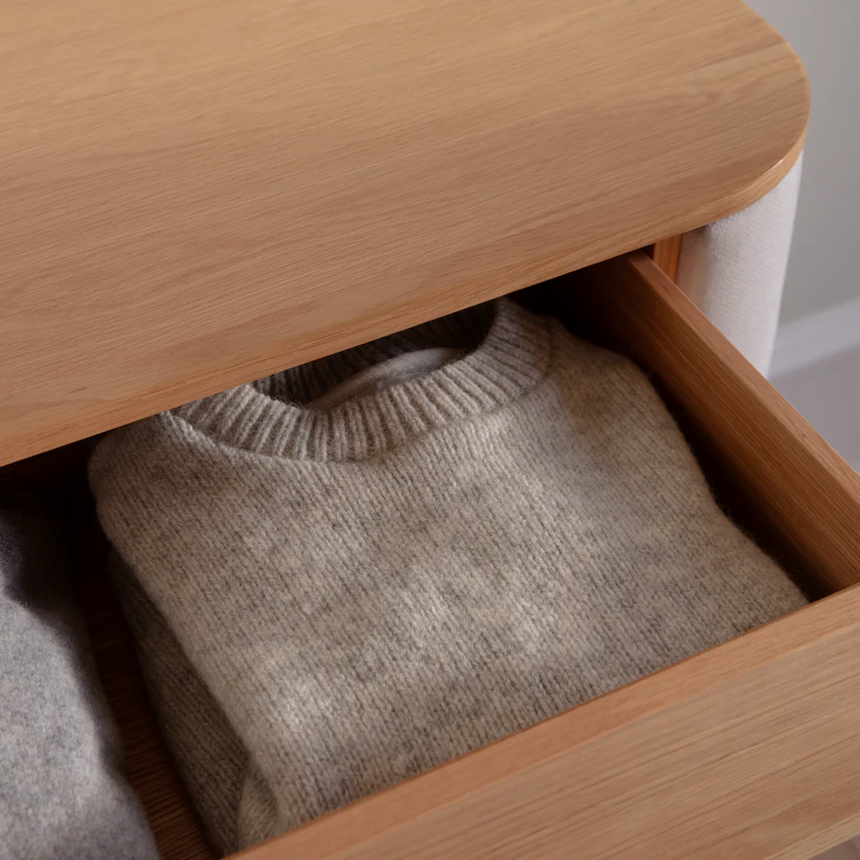 The Conversation Piece fabric armchair with natural frame