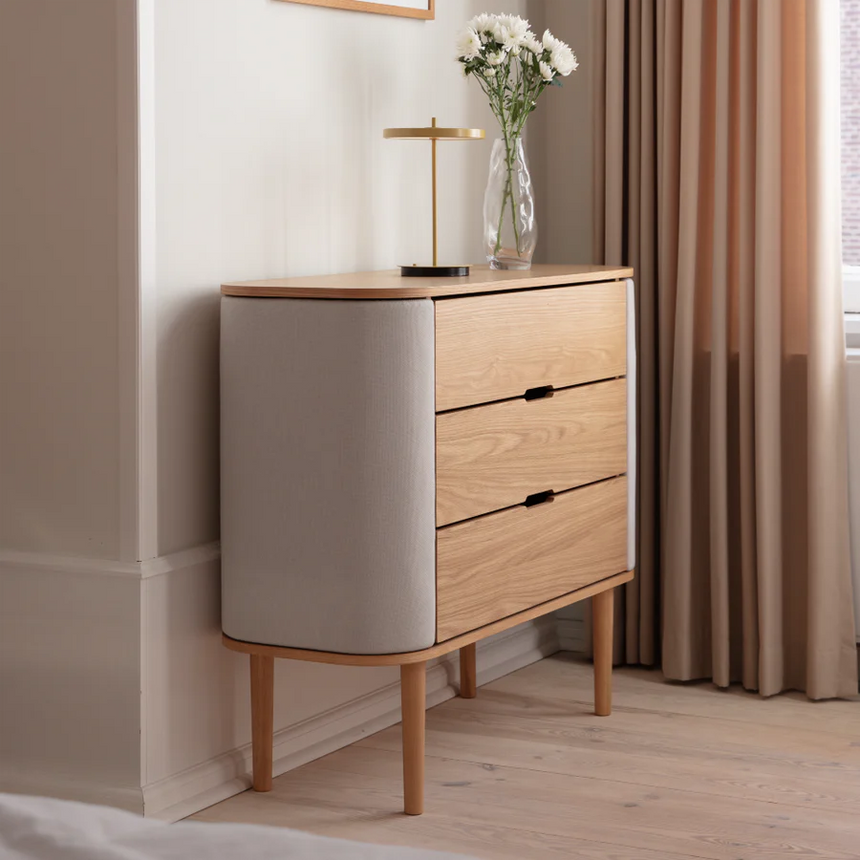 The Conversation Piece fabric armchair with natural frame