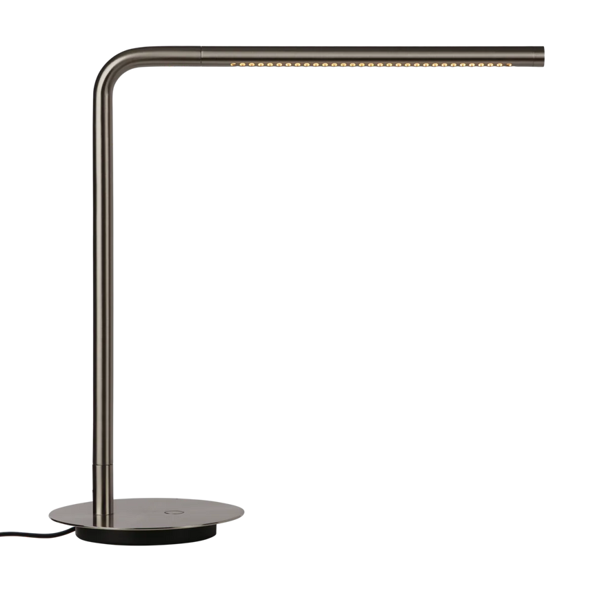 The Conversation Piece fabric armchair with natural frame