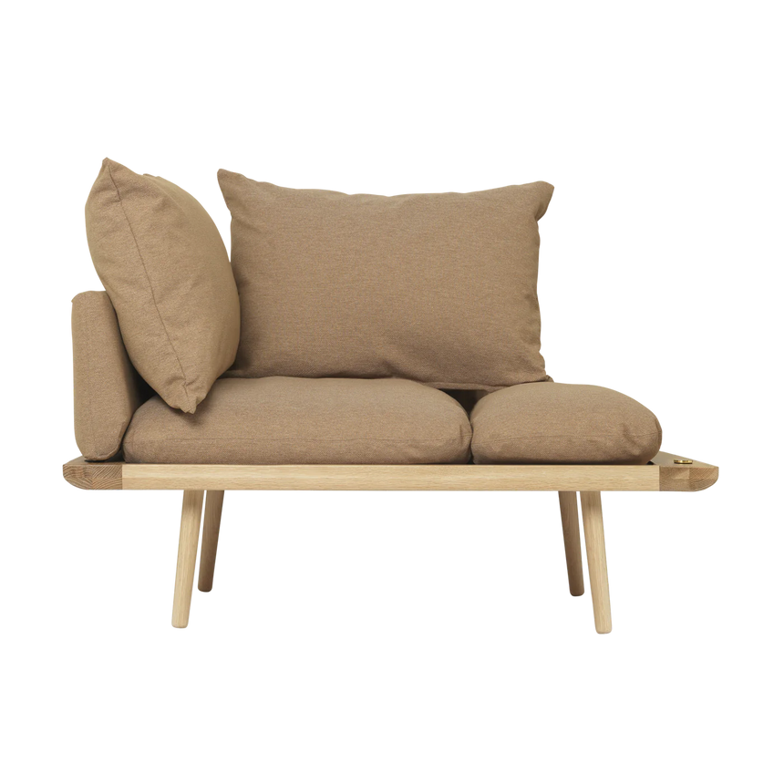 The Conversation Piece fabric armchair with natural frame